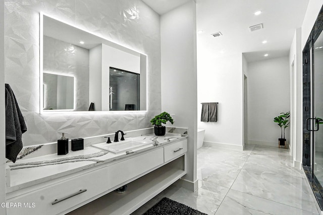 6325 Camino Pinon, El Paso, TX 79932 - full bathroom featuring vanity, marble finish flooring, a soaking tub, a stall shower, and recessed lighting