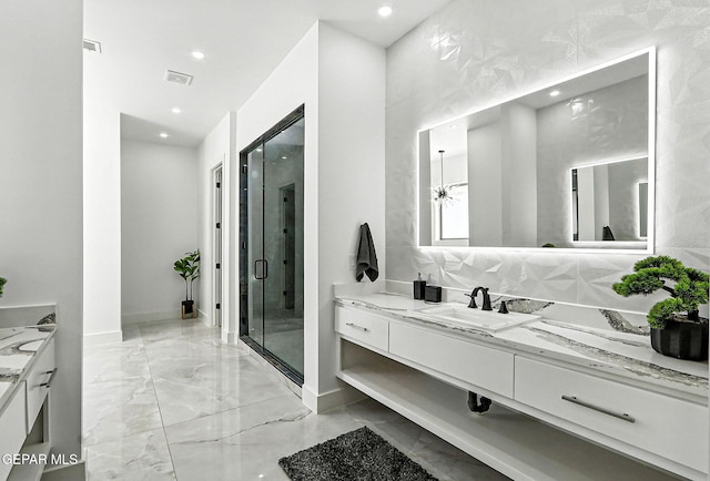 6325 Camino Pinon, El Paso, TX 79932 - full bathroom featuring vanity, marble tiled flooring, a shower stall, and recessed lighting