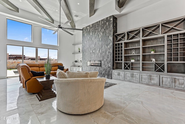 6325 Camino Pinon, El Paso, TX 79932 - living room with beamed ceiling, marble tiled flooring, a high ceiling, and a ceiling fan