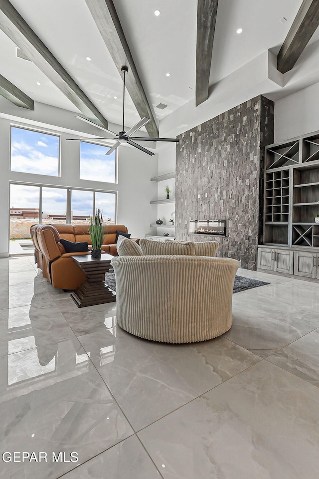 6325 Camino Pinon, El Paso, TX 79932 - living area featuring marble tiled flooring, beamed ceiling, a ceiling fan, and recessed lighting