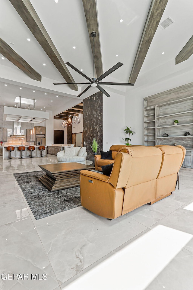 6325 Camino Pinon, El Paso, TX 79932 - living area with beam ceiling, marble tiled floors, recessed lighting, and ceiling fan