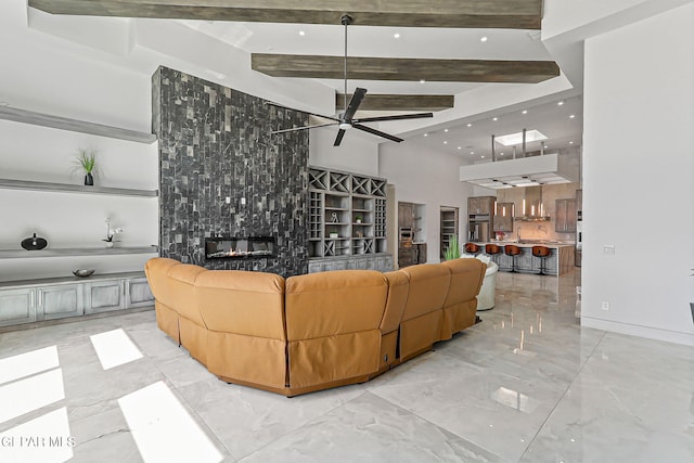 6325 Camino Pinon, El Paso, TX 79932 - living area featuring ceiling fan, light marble finish flooring, beam ceiling, a fireplace, and recessed lighting