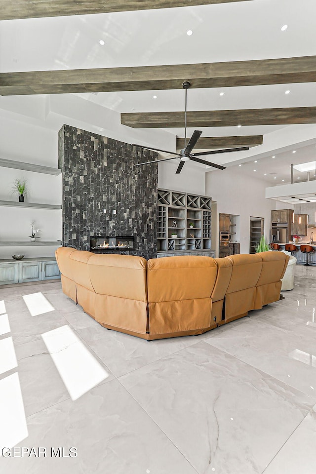 6325 Camino Pinon, El Paso, TX 79932 - living area with beam ceiling, ceiling fan, and recessed lighting
