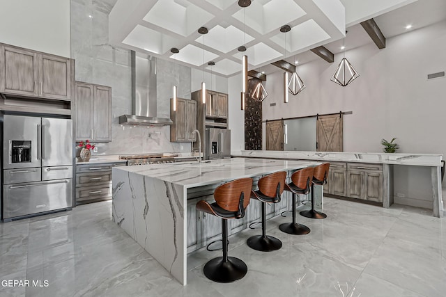 6325 Camino Pinon, El Paso, TX 79932 - kitchen featuring high end refrigerator, light marble finish flooring, wall chimney range hood, a barn door, and coffered ceiling