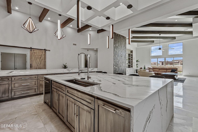 6325 Camino Pinon, El Paso, TX 79932 - kitchen featuring beamed ceiling, a towering ceiling, light marble finish flooring, a ceiling fan, and a barn door
