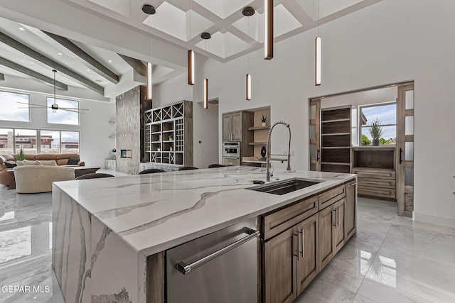 6325 Camino Pinon, El Paso, TX 79932 - kitchen featuring a towering ceiling, light marble finish flooring, open floor plan, beamed ceiling, and dishwasher