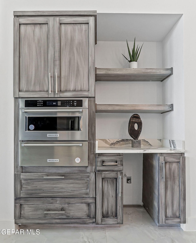6325 Camino Pinon, El Paso, TX 79932 - kitchen featuring open shelves, stainless steel oven, a warming drawer, and light countertops