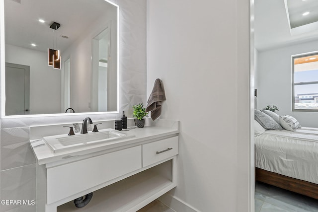 6325 Camino Pinon, El Paso, TX 79932 - ensuite bathroom with vanity and recessed lighting