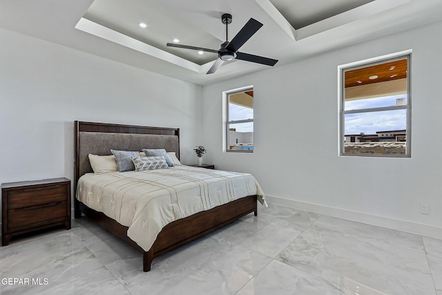 6325 Camino Pinon, El Paso, TX 79932 - bedroom with light marble finish floors, recessed lighting, a tray ceiling, and a ceiling fan