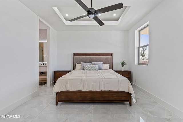 6325 Camino Pinon, El Paso, TX 79932 - bedroom with light marble finish flooring, ensuite bathroom, a tray ceiling, and ceiling fan