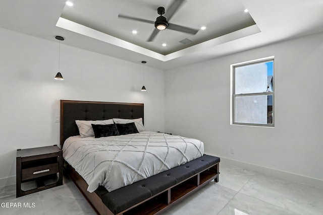 6325 Camino Pinon, El Paso, TX 79932 - bedroom featuring a raised ceiling, recessed lighting, light marble finish flooring, and a ceiling fan