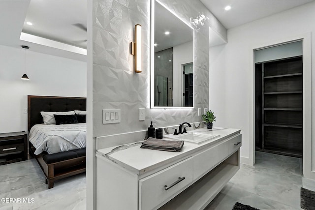 6325 Camino Pinon, El Paso, TX 79932 - bathroom with marble finish floors, vanity, recessed lighting, and ensuite bath
