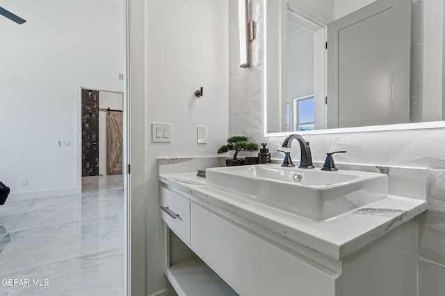 6325 Camino Pinon, El Paso, TX 79932 - bathroom featuring vanity and baseboards