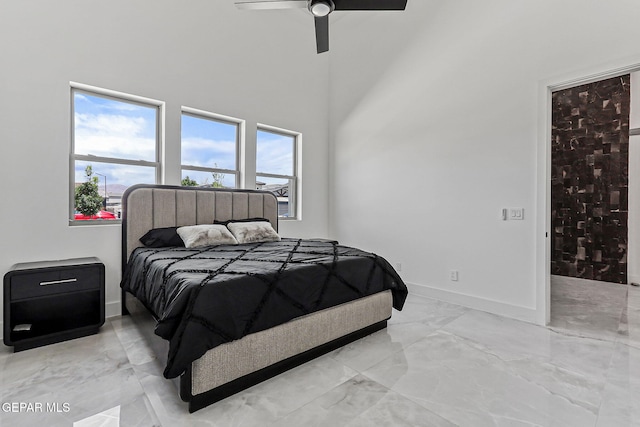 6325 Camino Pinon, El Paso, TX 79932 - bedroom with light marble finish flooring, a towering ceiling, and ceiling fan