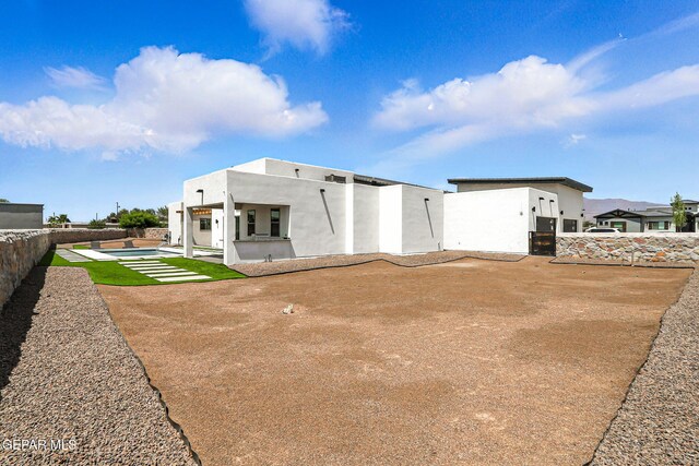 6325 Camino Pinon, El Paso, TX 79932 - rear view of property featuring a patio area and stucco siding