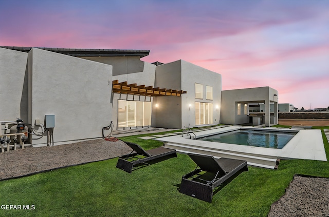 6325 Camino Pinon, El Paso, TX 79932 - back of property featuring a pergola, stucco siding, an outdoor pool, and a patio