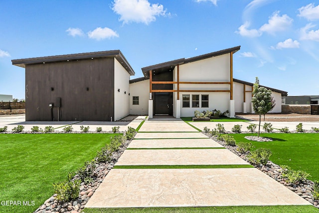 6325 Camino Pinon, El Paso, TX 79932 - contemporary home with a front yard and stucco siding