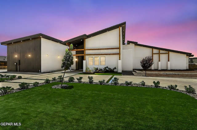 6325 Camino Pinon, El Paso, TX 79932 - view of front of house with stucco siding and a lawn