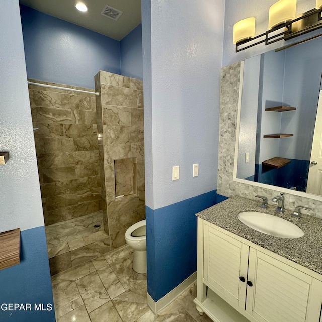 3026 Findley Ave, El Paso, TX 79905 - bathroom with a walk in shower, vanity, marble finish flooring, and a textured wall