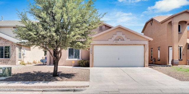 7029 Copper Canyon Dr, El Paso, TX 79934 - view of front of property featuring an attached garage, stucco siding, and concrete driveway