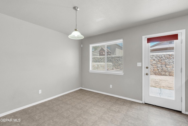7029 Copper Canyon Dr, El Paso, TX 79934 - unfurnished dining area featuring baseboards