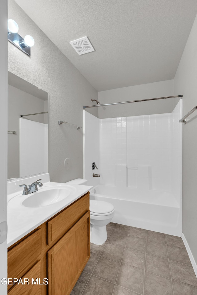 7029 Copper Canyon Dr, El Paso, TX 79934 - full bath featuring vanity, shower / bath combination, a textured ceiling, and tile patterned floors