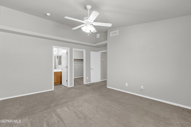 7029 Copper Canyon Dr, El Paso, TX 79934 - unfurnished bedroom with carpet, a walk in closet, a closet, and ceiling fan