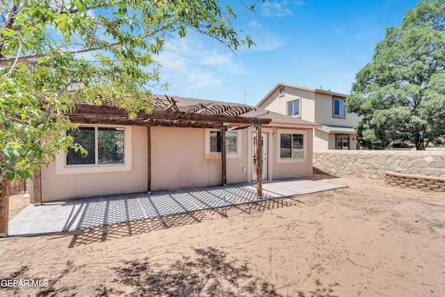 7029 Copper Canyon Dr, El Paso, TX 79934 - rear view of property featuring a pergola, a patio area, and stucco siding