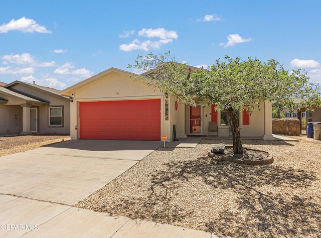 11652 Ochre Bluff Ln, El Paso, TX 79934 - view of front of property featuring an attached garage, driveway, and stucco siding