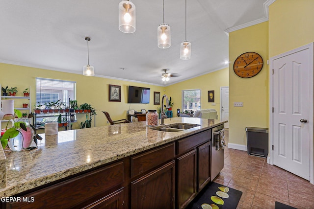 11652 Ochre Bluff Ln, El Paso, TX 79934 - kitchen featuring ornamental molding, stainless steel dishwasher, open floor plan, decorative light fixtures, and dark brown cabinets