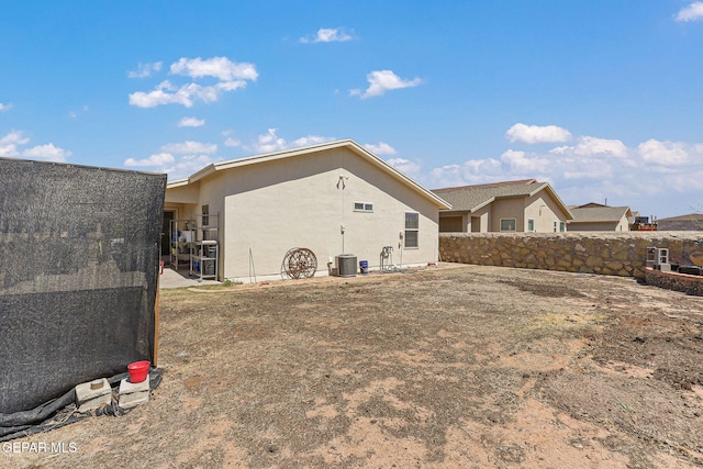 11652 Ochre Bluff Ln, El Paso, TX 79934 - rear view of property featuring stucco siding