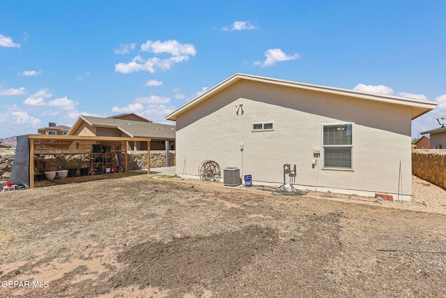 11652 Ochre Bluff Ln, El Paso, TX 79934 - rear view of property with stucco siding