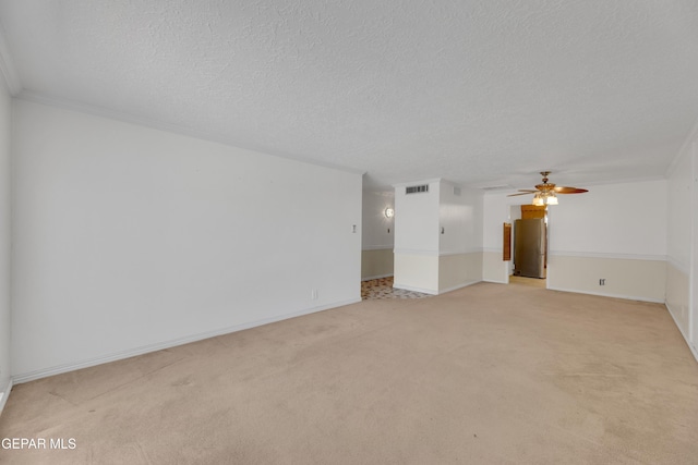 3313 Dublin Rd, El Paso, TX 79925 - empty room with ceiling fan, light colored carpet, a textured ceiling, and crown molding