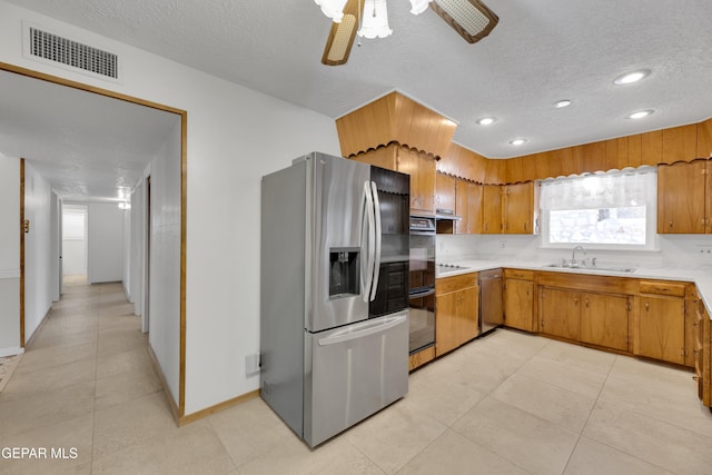 3313 Dublin Rd, El Paso, TX 79925 - kitchen featuring black appliances, a textured ceiling, light countertops, ceiling fan, and brown cabinets