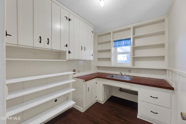 3313 Dublin Rd, El Paso, TX 79925 - unfurnished office with a textured ceiling and dark wood finished floors