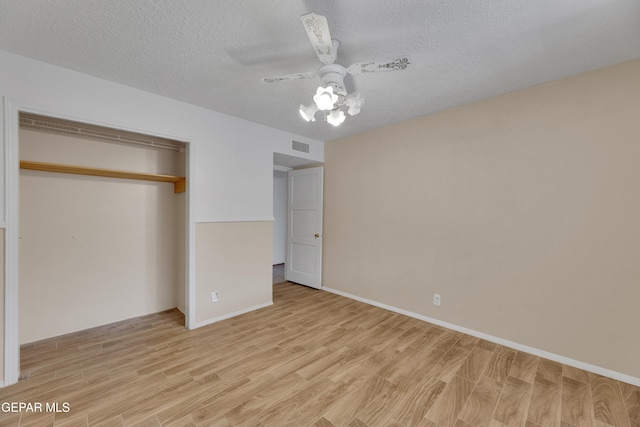 3313 Dublin Rd, El Paso, TX 79925 - unfurnished bedroom with light wood-style flooring, a closet, a textured ceiling, and ceiling fan