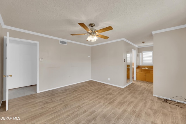 3313 Dublin Rd, El Paso, TX 79925 - unfurnished room featuring light wood-type flooring, a ceiling fan, a textured ceiling, and ornamental molding