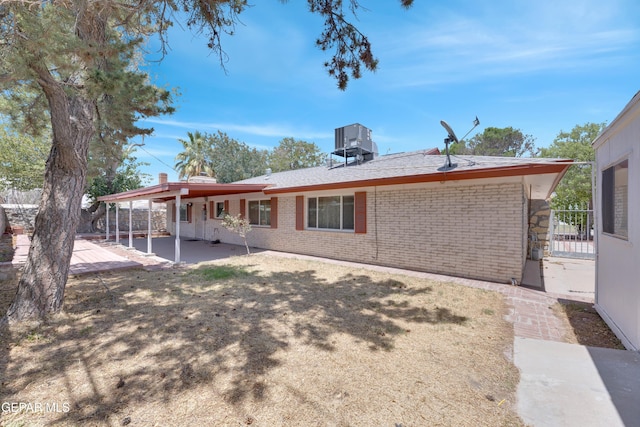 3313 Dublin Rd, El Paso, TX 79925 - back of house featuring a patio and brick siding
