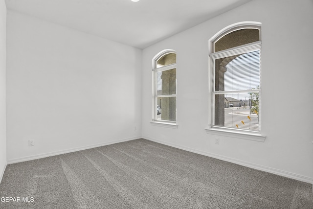 14373 Nick Drahos Ln, Horizon City, TX 79928 - unfurnished room featuring plenty of natural light and carpet