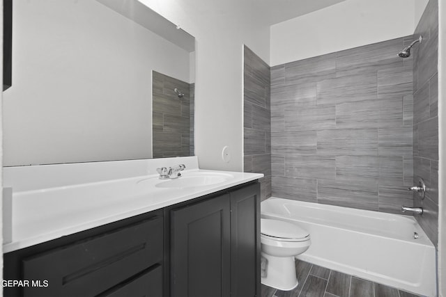 14373 Nick Drahos Ln, Horizon City, TX 79928 - bathroom featuring tub / shower combination, vanity, and wood finished floors