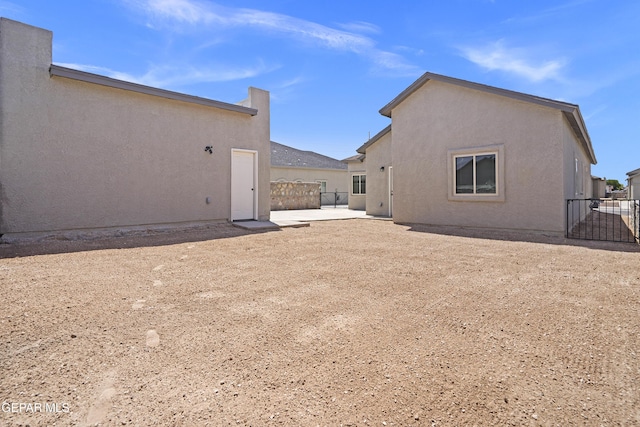 14373 Nick Drahos Ln, Horizon City, TX 79928 - back of house with a patio and stucco siding