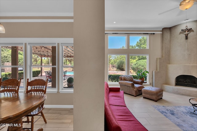 981 Vereda Del Valle Ave, El Paso, TX 79932 - living room featuring a ceiling fan, crown molding, and a premium fireplace