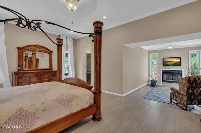 981 Vereda Del Valle Ave, El Paso, TX 79932 - bedroom featuring recessed lighting, crown molding, a tile fireplace, and a ceiling fan
