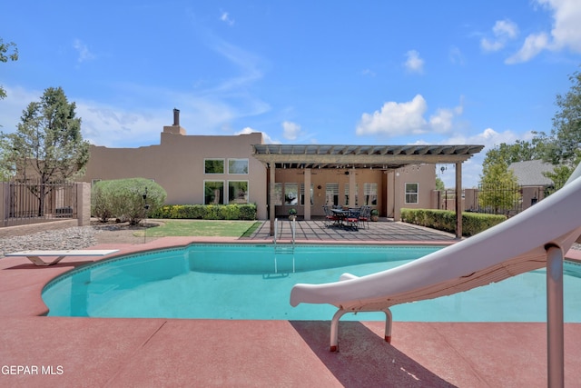 981 Vereda Del Valle Ave, El Paso, TX 79932 - view of swimming pool featuring a water slide, a patio area, and a diving board