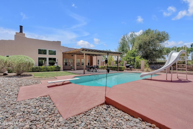 981 Vereda Del Valle Ave, El Paso, TX 79932 - view of pool with a water slide, a diving board, a pergola, and a patio area