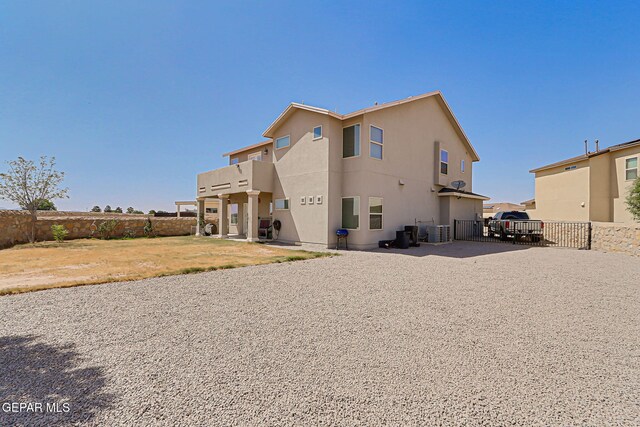 13847 Alamito Creek Ave, Clint, TX 79836 - rear view of house with a fenced backyard, stucco siding, and a gate