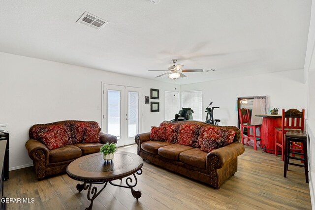 13847 Alamito Creek Ave, Clint, TX 79836 - living area with ceiling fan, french doors, and wood finished floors