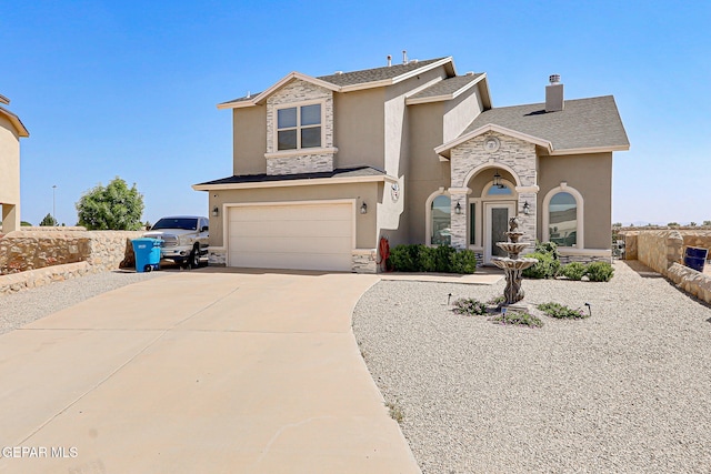 13847 Alamito Creek Ave, Clint, TX 79836 - view of front of home with stone siding, stucco siding, and an attached garage