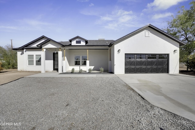 10478 Monte Mayor Dr, Socorro, TX 79927 - modern farmhouse style home featuring an attached garage, concrete driveway, and stucco siding