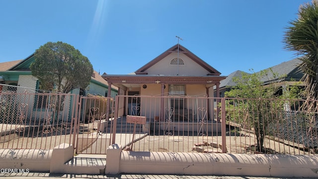 1312 Wyoming Ave, El Paso, TX 79902 - view of front facade with a gate and stucco siding